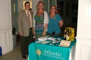 People standing next to an awards table