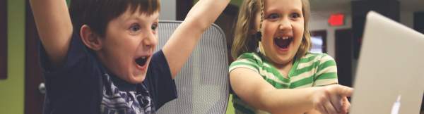 Children Laughing While Playing a Game